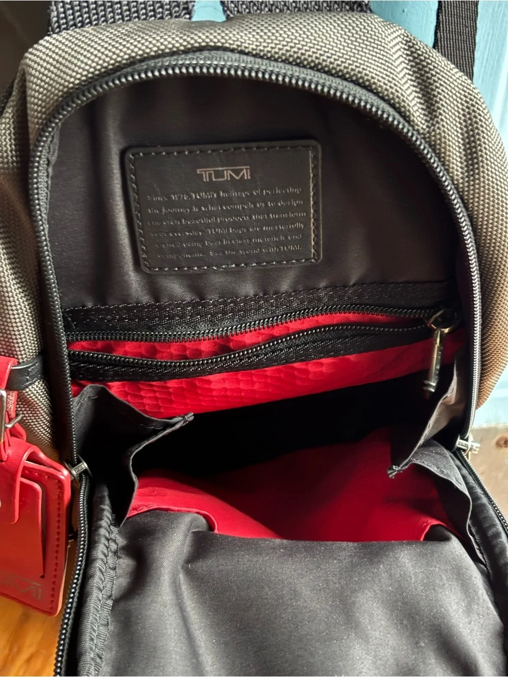 Tumi FIFE Gray SLIM Sling Bag dark grey and black.